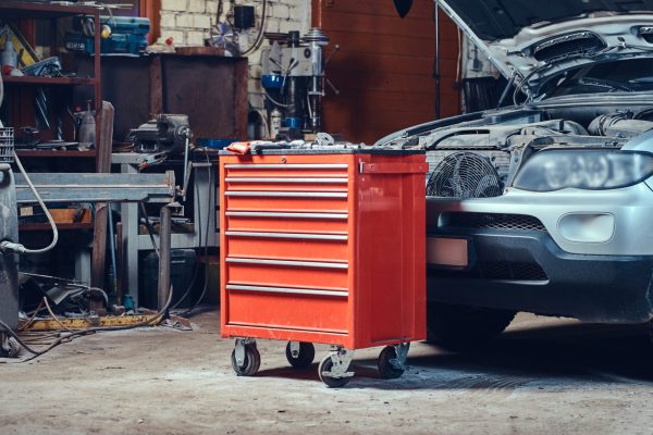 red-tool-box-in-a-garage-T68H99Z red-tool-box-in-a-garage-T68H99Z